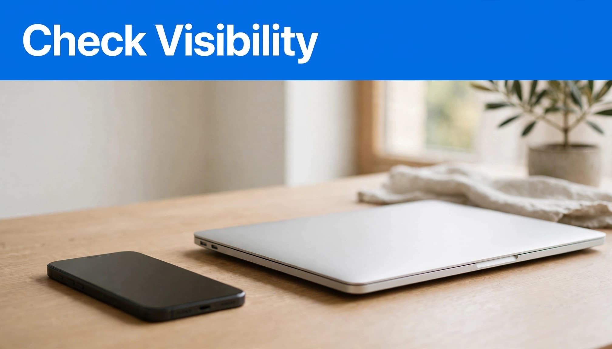 AirDrop Not Working? Fix Apple Device Transfers 1 An iPhone and MacBook Air sit beneath a blue Check Visibility banner.
