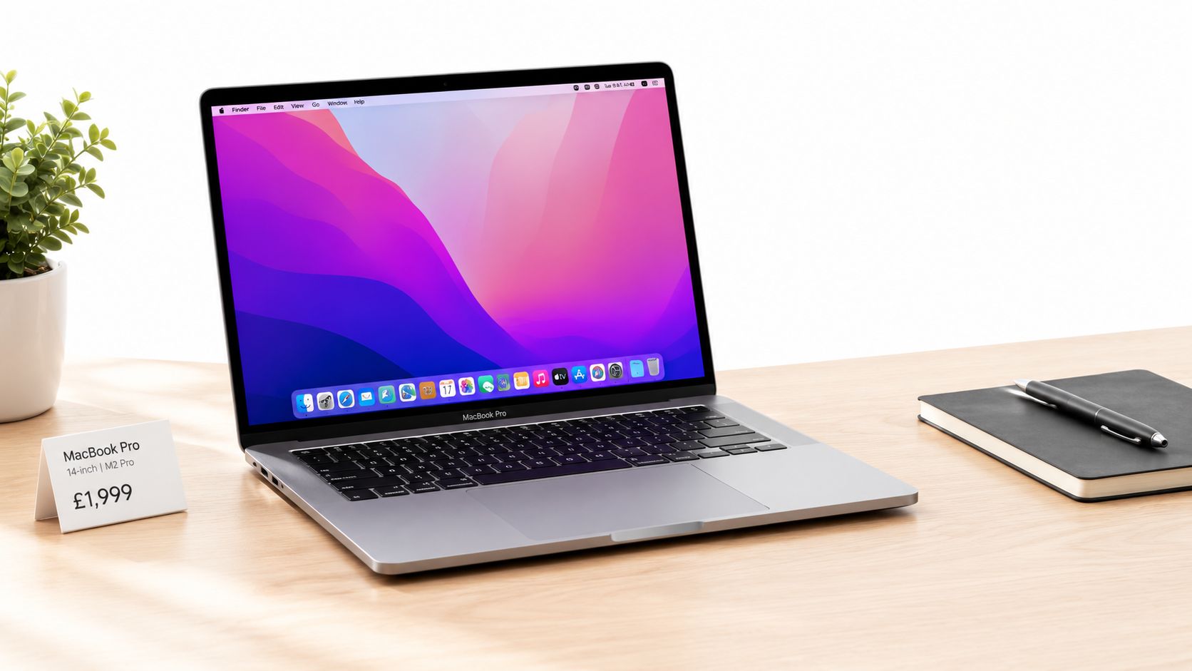 MacBook Pro Sale UK 2026: How to Time and Verify Deals 1 A silver MacBook Pro laptop on a wooden desk next to a notebook, pen, and price tag.